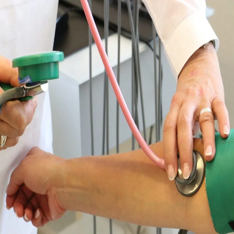 doctor checking the pressure of a patient